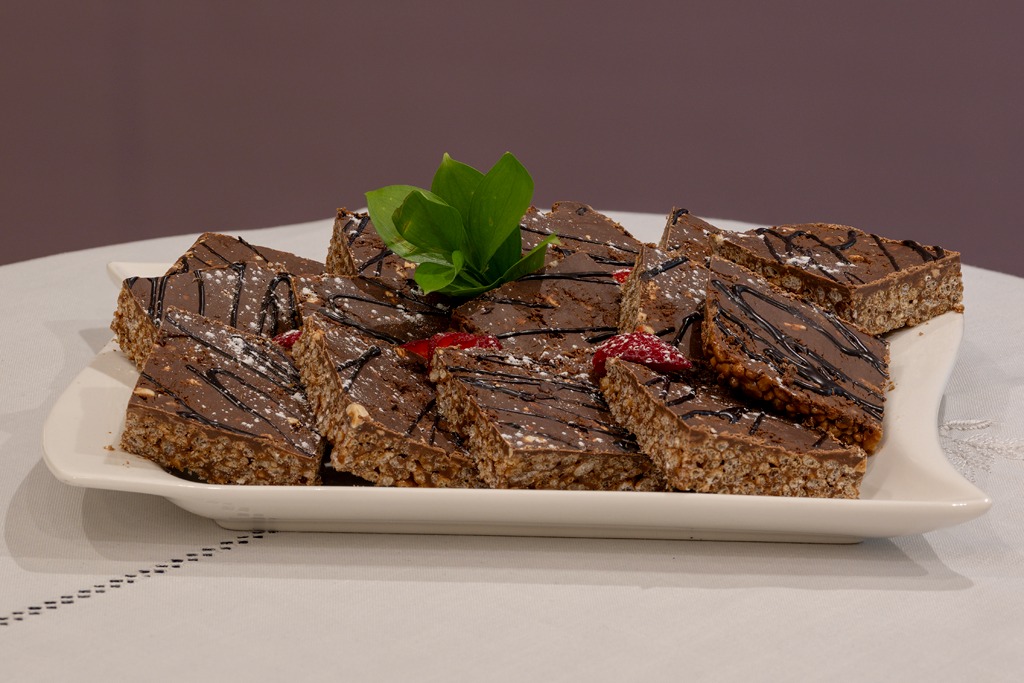 Chocolate crunch slices on a white platter