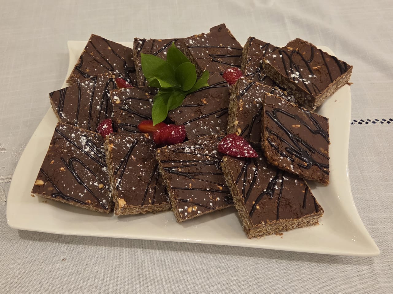 Chocolate crunch slices on a white platter