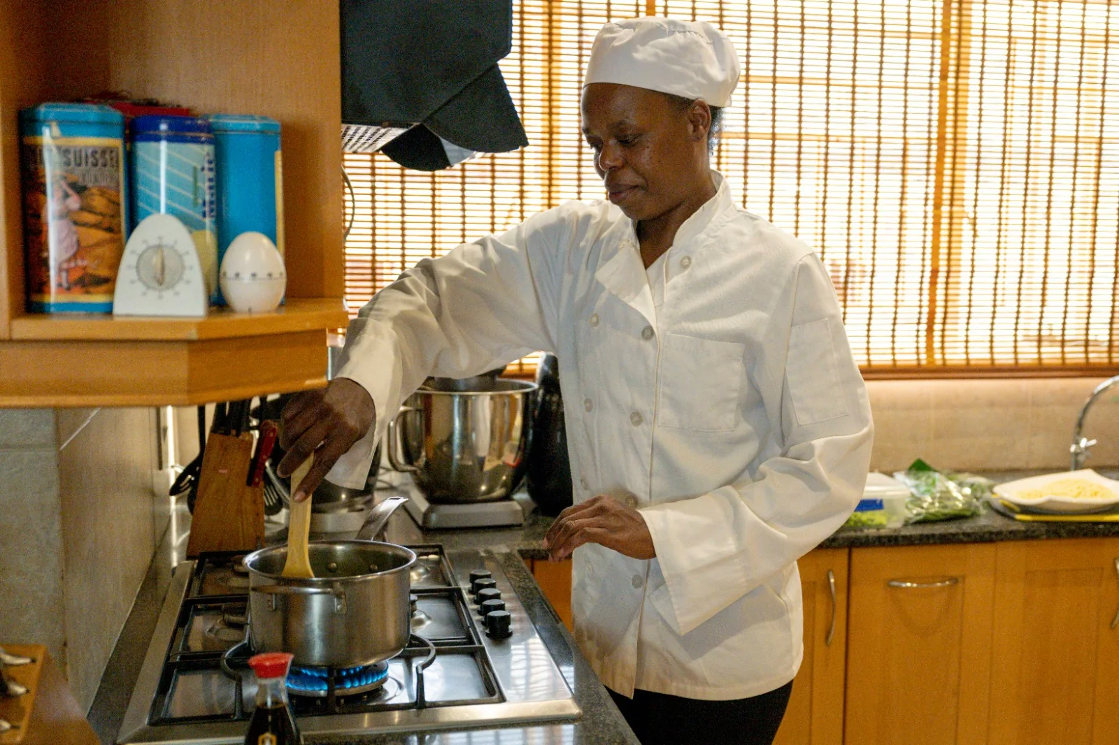 Cleo cooking a fresh family meal on the stove