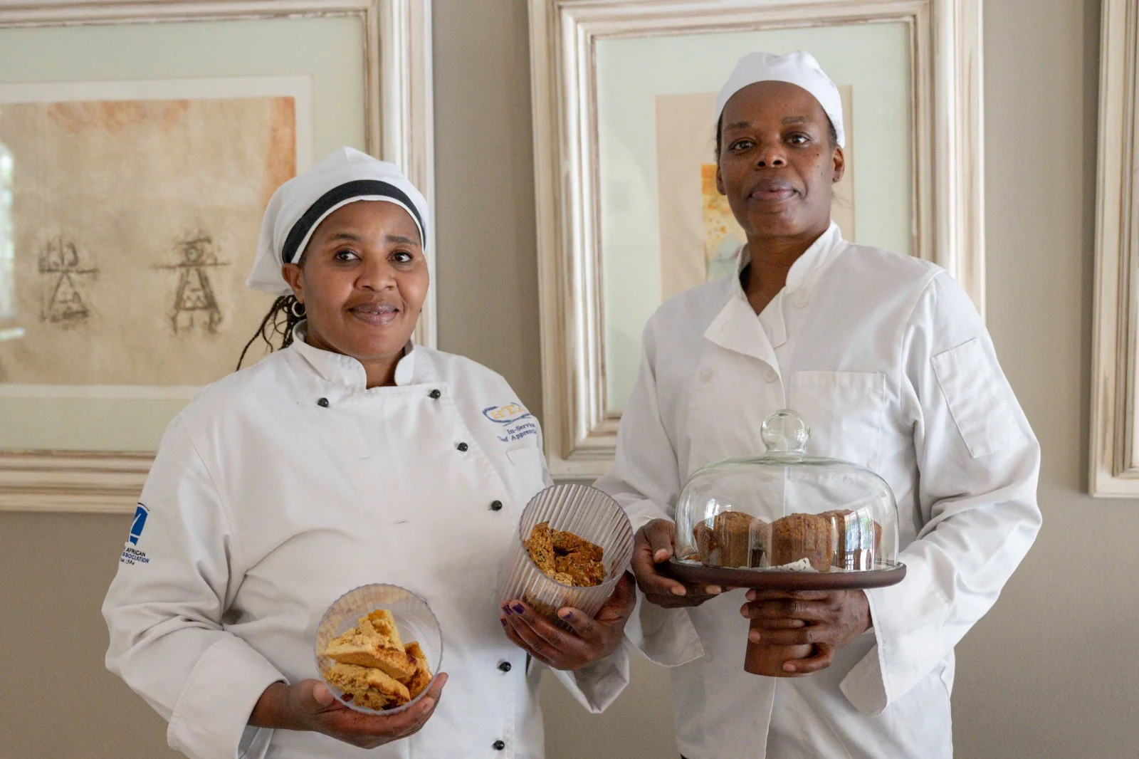 Joyce and Cleo presenting a selection of their home-baked biscuits