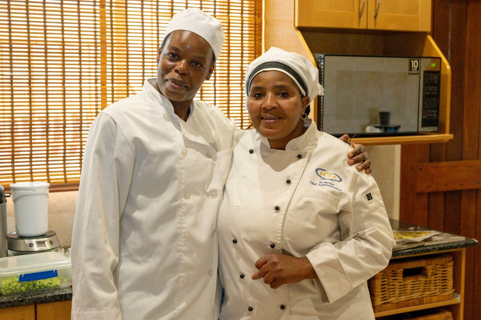 Joyce and Cleo together in their kitchen